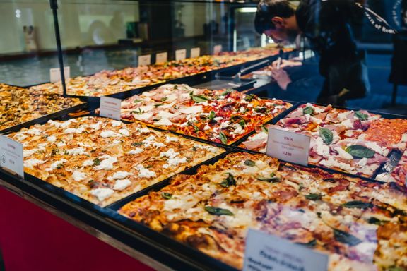 Pan pizzas on display at Spizzico, a Roman-style pizza restaurant in Wellington.