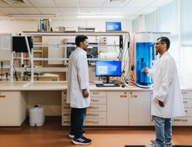 Two scientists work in the Xplora Ventures lab.