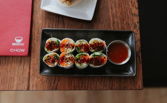Vegetable spring rolls with cos lettuce and sweet chilli dipping sauce.