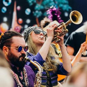 A trumpet player performs in a jazz ensemble.
