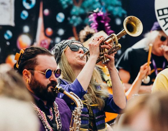 A trumpet player performs in a jazz ensemble.