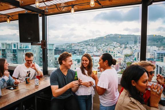 Customers enjoy a drink on the rooftop bar Dirty Little Secret.