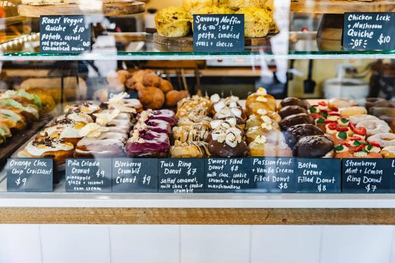 Doughnuts in the pastry window at Belén Vegan Bakery located at 104 Lambton Quay in Wellington Central.