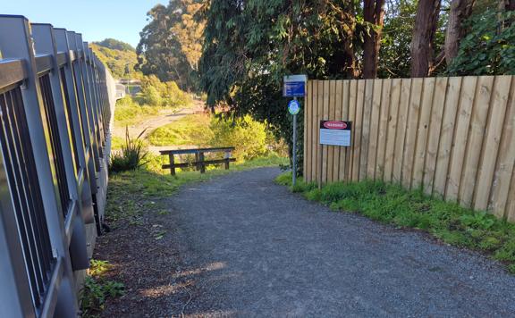Trail entry/exit with a slight gradient on the Waikanae River Trail.