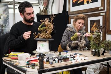 Two people are doing a prop-making activity at Wētā Workshop in Miramar, Wellington.