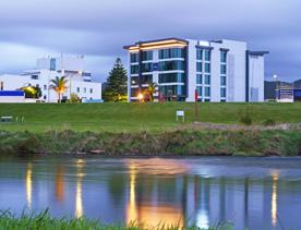 Looking across the Hutt river at The Sebel hotel at Sunset.
