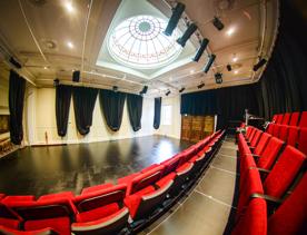 The gold and red interior of Bats Theatre.