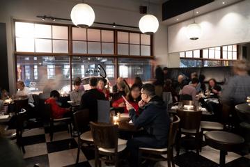 Interior shot of busy restaurant atmosphere.