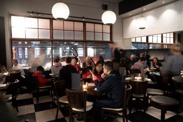 Interior shot of busy restaurant atmosphere.