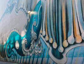 The Kia whakatōmuri te haere whakamua (walking backwards into the future) street art mural was created by artists Keri Mei Zagrobelna and Tina Rae Carter.