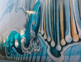 The Kia whakatōmuri te haere whakamua (walking backwards into the future) street art mural was created by artists Keri Mei Zagrobelna and Tina Rae Carter.