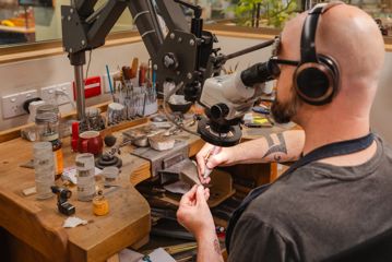 A person used a microscope to create a ring.