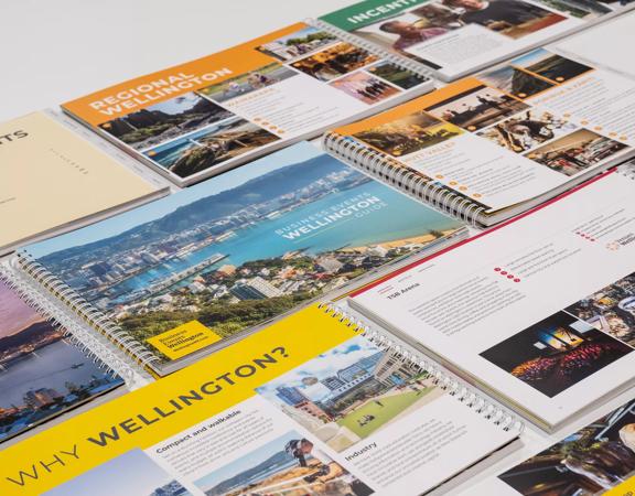 A range of WellingtonNZ information booklets laid out on a table.