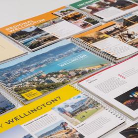A range of WellingtonNZ information booklets laid out on a table.
