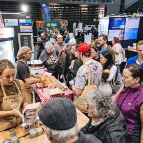 A photograph of people shopping at the Go Green Expo at TSB Arena in Wellington