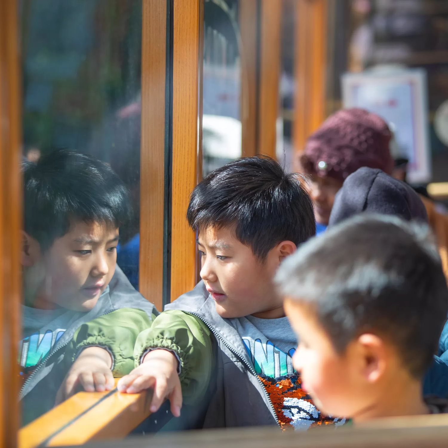 A family of four rides the Wellington Cable Car.