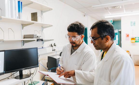 Two scientists review a chart while working in the Xplora Ventures lab.