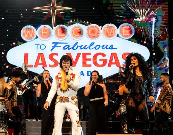 The Las Vegas tribute show, Legends in Concert, performing on stage as Elvis and Cher.