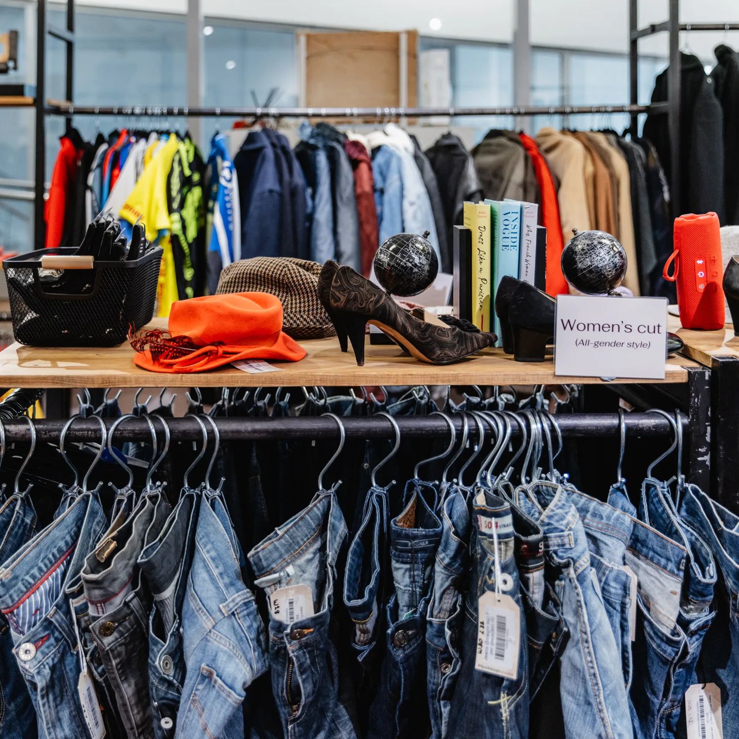 Clothing racks inside Frip Vintage.