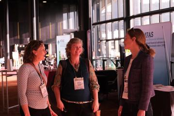 Three people chatting at the New Zealand Women in Medicine Conference 2024.