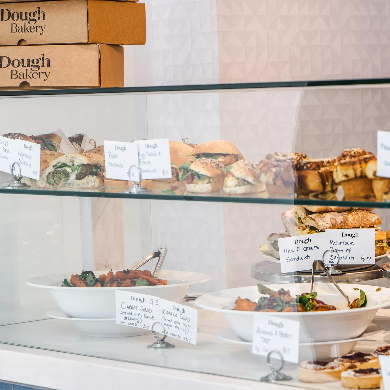 The display window at Dough Bakery Lombard Lane in Te ARo, Wellington, is filled with fresh baked goods for sale.