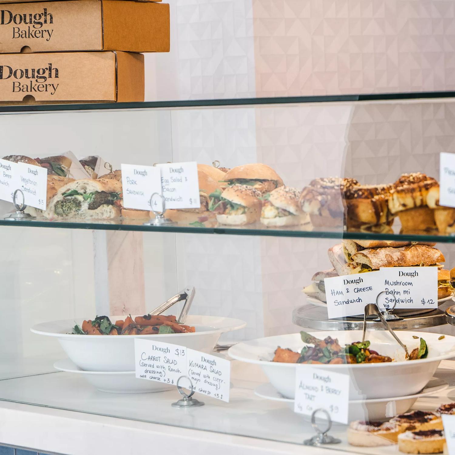 The display window at Dough Bakery Lombard Lane in Te ARo, Wellington, is filled with fresh baked goods for sale. 