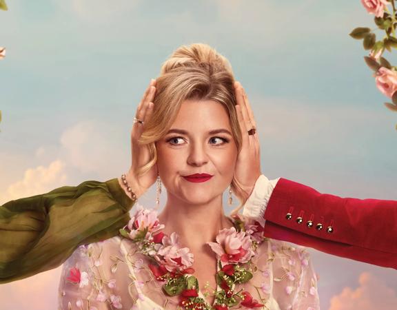 An opera performer with other people's hands from out of frame over their ears on a blue sky background.