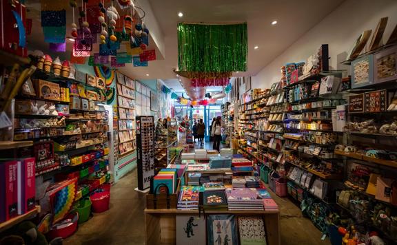 the colourful interior of Iko Iko, with gifts and souvineers along each wall.