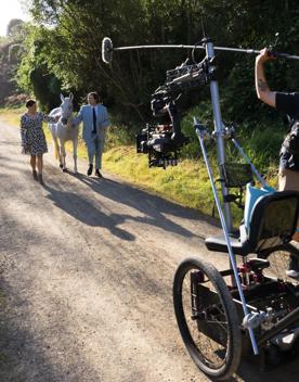 Two people with filming gear on the set of Small Town Scandal