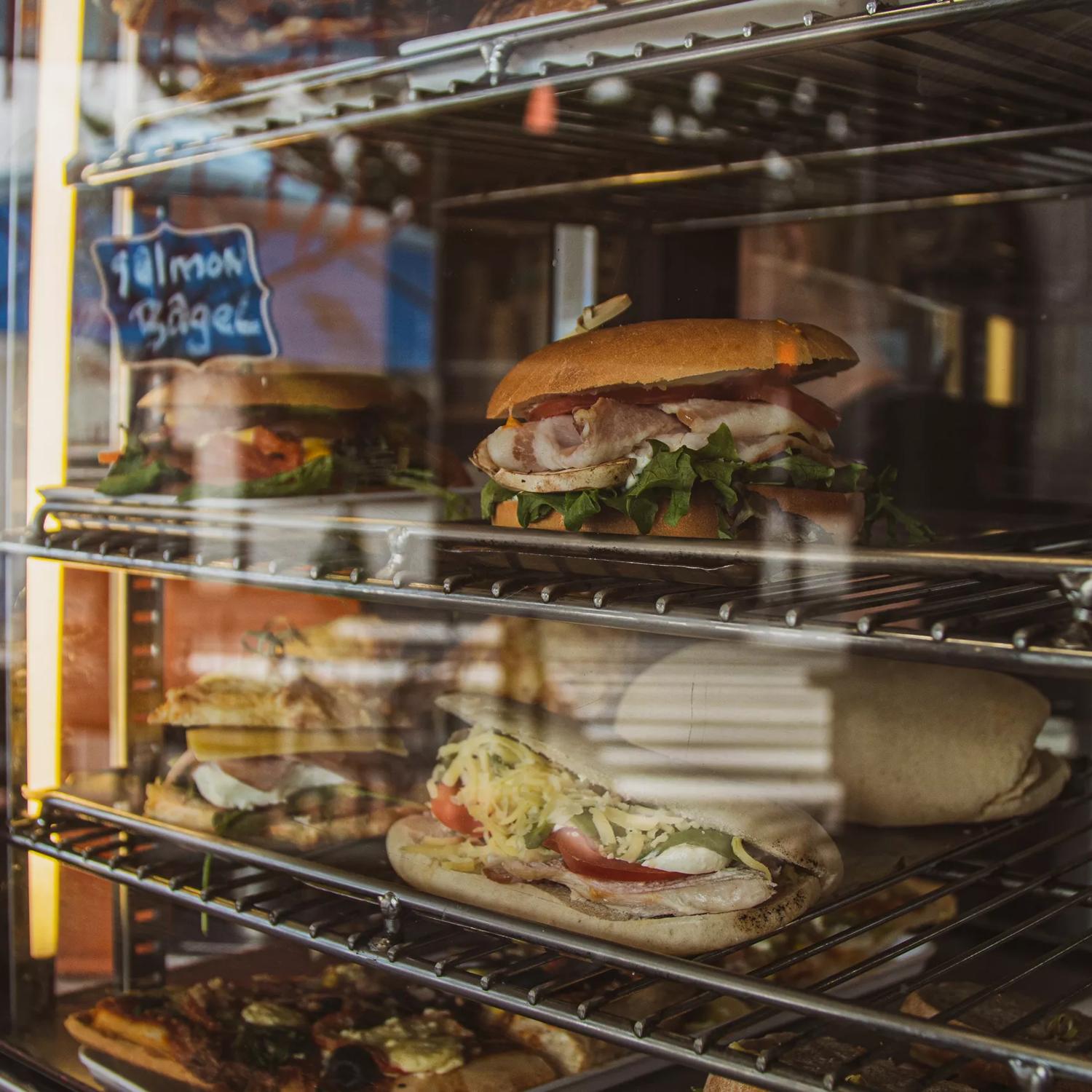 Sandwiches inside of a glass cabinet at The Big Salami cafe in Porirua.