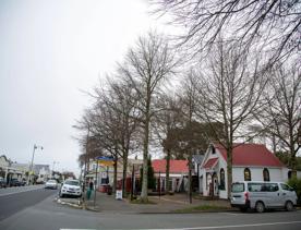 The screen location of Greytown, a historic small town featuring Victorian buildings,  stables, colonial cottages, and rural landscapes surrounding.