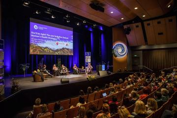 A panel discussion on stage at the New Zealand Women in Medicine Conference 2022 at Te Papa.