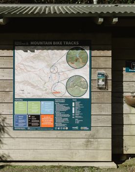 An informational poster with a map of Mountain Bike Tracks at Belmont Regional Park.