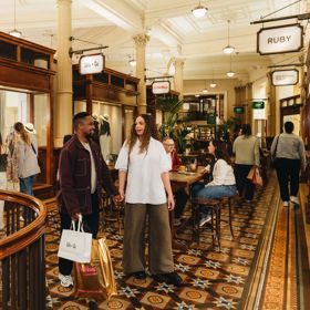 Two people shopping in Old Bank Arcade.