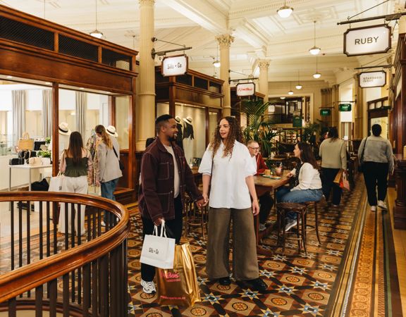 Two people shopping in Old Bank Arcade.