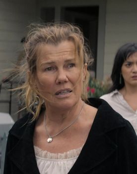 A production still from the series After the Party filmed in Wellington. Penny (played by Robyn Malcolm) is standing outside a house looking surprised and upset with Kate (played by Kirana Geata) standing behind her.