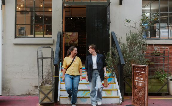 Two friends leave the Wellington Chocolate Factory.