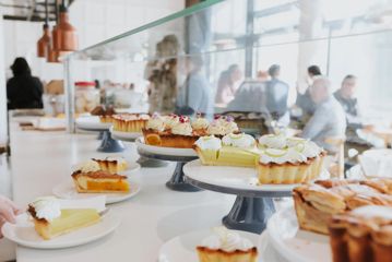 A variety of fruit pies for sale on the counter at Pickle & Pie café.