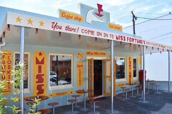 The front facade of Miss Fortune's, a small colourful coffee shop in Gracefield Lower Hutt.