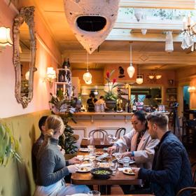 Four friends enjoy dinner and drinks at Havana Bar and Restaurant in Wellington.