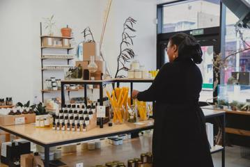 A person shopping in a health and wellness store.