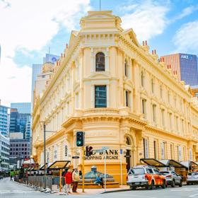 The mix of modern and old buildings along Lambton Quay, including the old supreme court, and old bank.