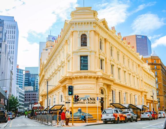 The mix of modern and old buildings along Lambton Quay, including the old supreme court, and old bank.