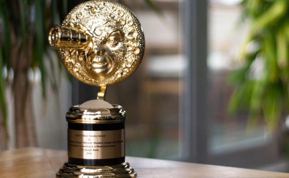 Gold VES Award sitting on a table.