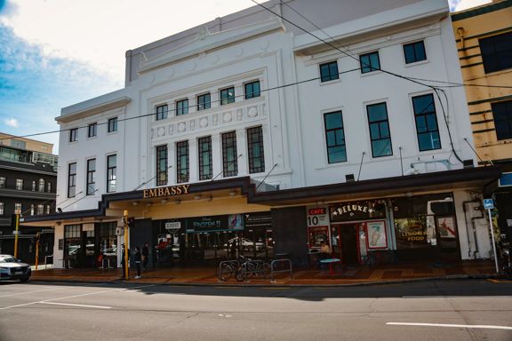 Exterior of the Embassy Theatre cinema with Deluxe cafe at the base of the building.
