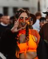 Person dressed in neon orange at Ultra New Zealand in Wellington.