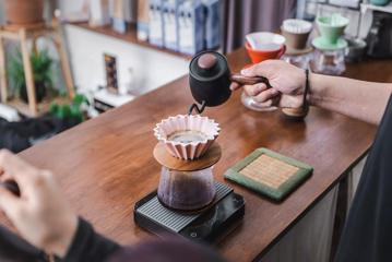 A barista prepares a pour-over coffee at Pour & Twist, a coffee bar in Te Aro, Wellington.