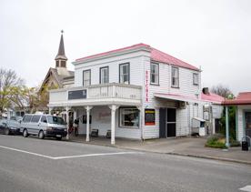The screen location of Greytown, a historic small town featuring Victorian buildings,  stables, colonial cottages, and rural landscapes surrounding.