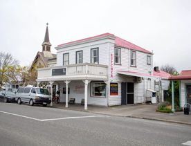 The screen location of Greytown, a historic small town featuring Victorian buildings,  stables, colonial cottages, and rural landscapes surrounding.