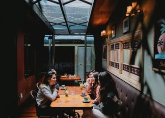 A group of five friends enjoy drinks at Havana Bar in Wellington.